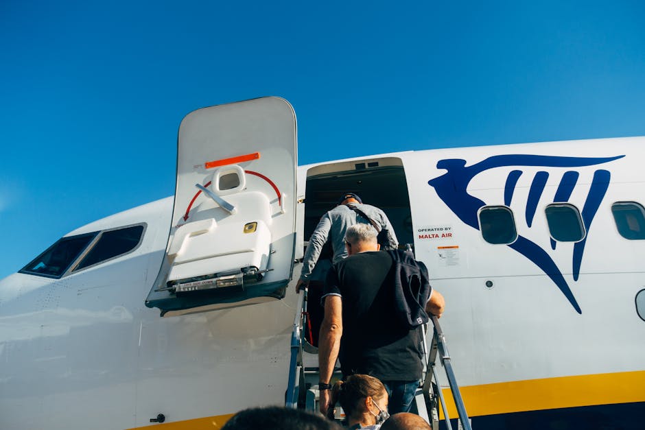 Travellers board a Ryanair plane for their flight