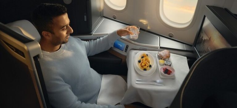 Customer enjoying their meal in Club World cabin.