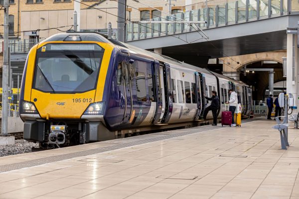 Northern train at platform with doors open